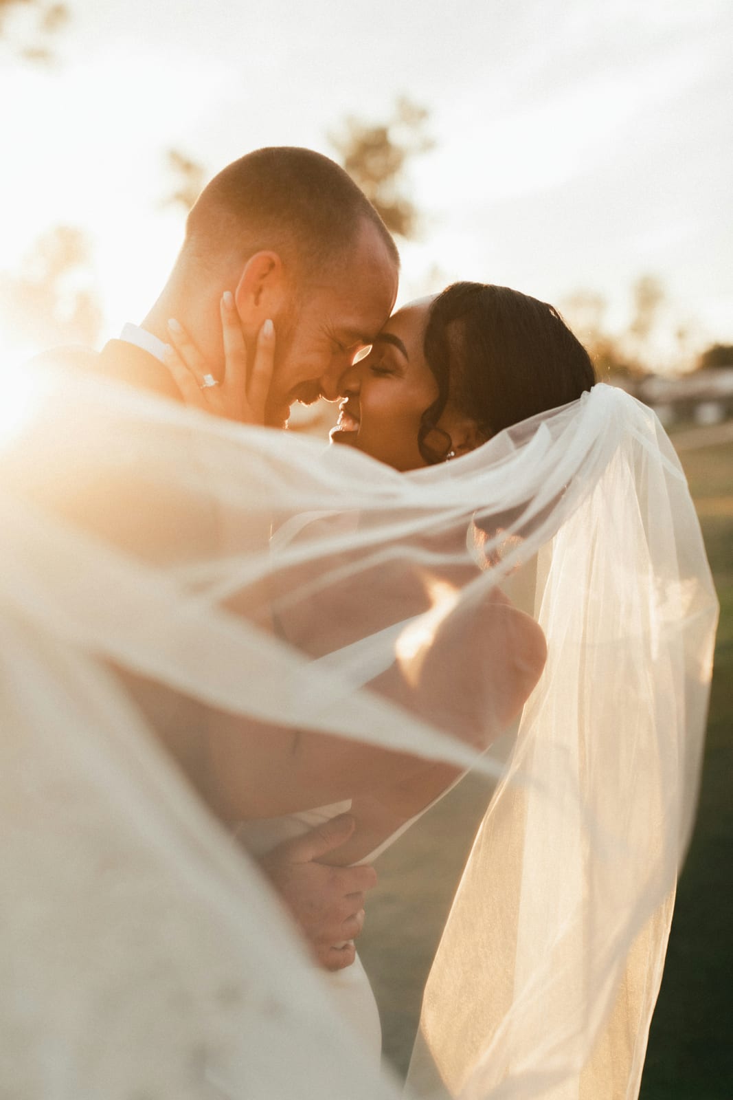 Couple in a veil moment