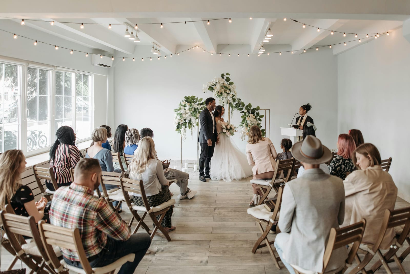 Ceremony in a hall with string lights